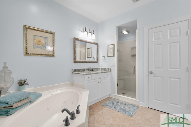 bathroom featuring vanity, tile patterned floors, and plus walk in shower