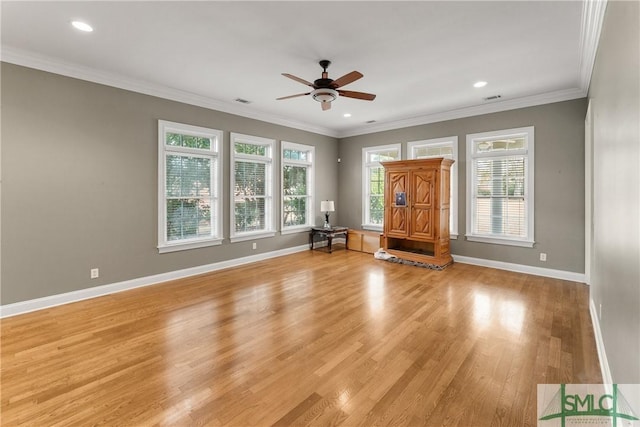 unfurnished living room with ornamental molding, light hardwood / wood-style floors, and ceiling fan