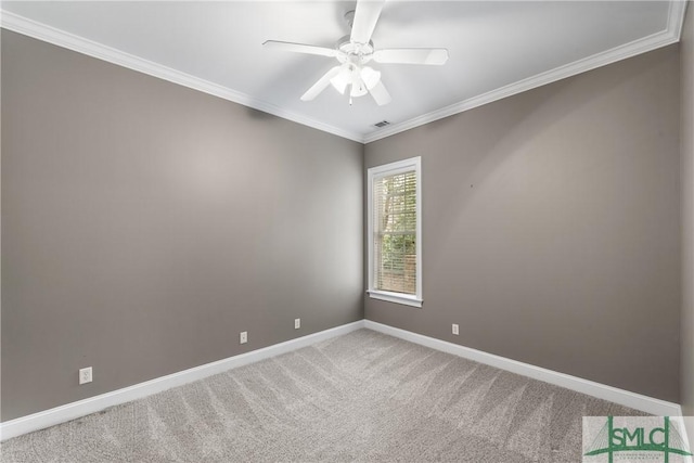 unfurnished room with crown molding, carpet, and ceiling fan