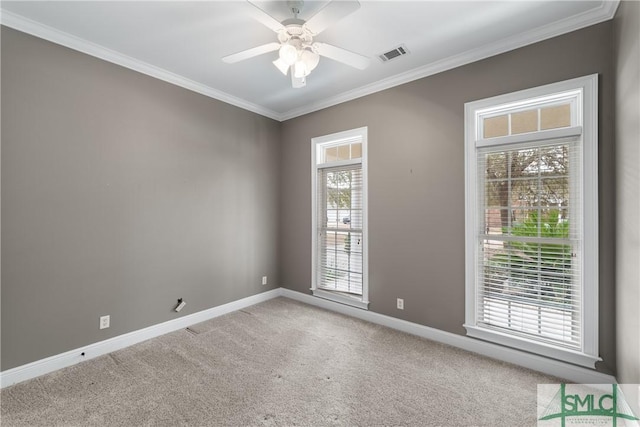 carpeted empty room featuring crown molding and ceiling fan