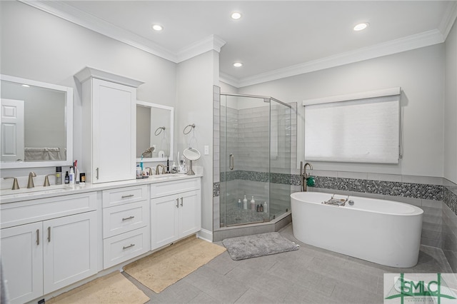 bathroom with crown molding, vanity, and separate shower and tub