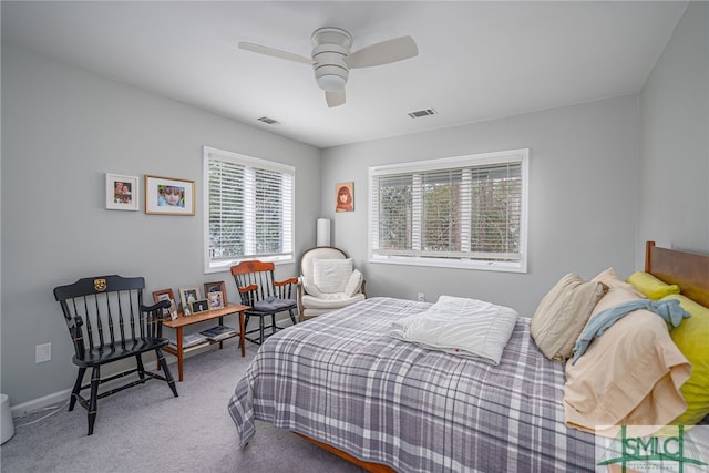 bedroom with ceiling fan and carpet floors