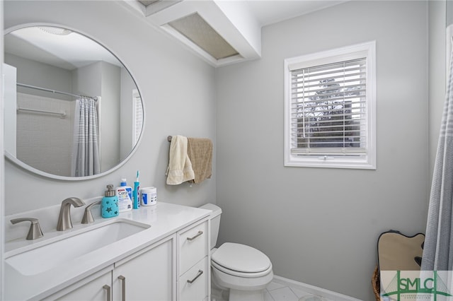 bathroom with vanity, curtained shower, and toilet