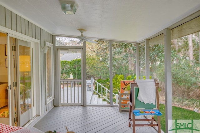 sunroom / solarium with ceiling fan