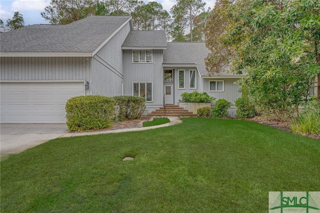 view of front of home featuring a garage and a front lawn