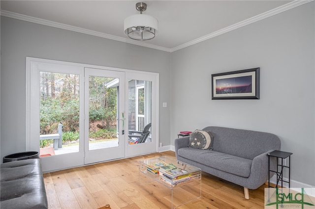 interior space featuring wood-type flooring, ornamental molding, and a wealth of natural light