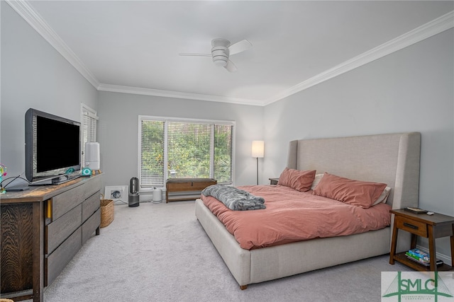 bedroom with crown molding, ceiling fan, and light carpet