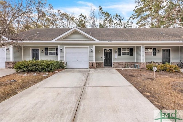 ranch-style house featuring a garage