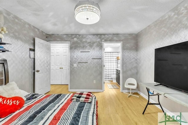 bedroom with light hardwood / wood-style flooring