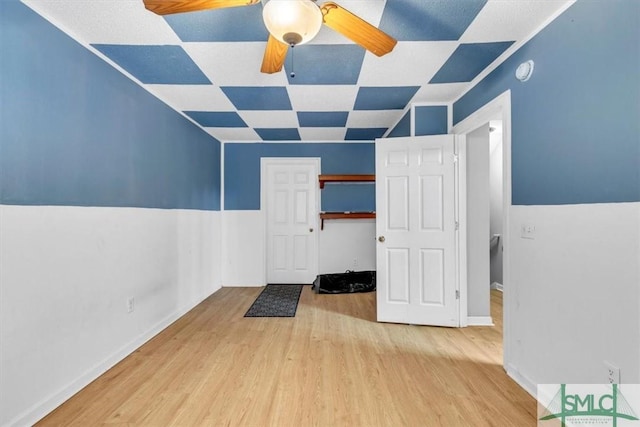 interior space featuring light hardwood / wood-style flooring and ceiling fan