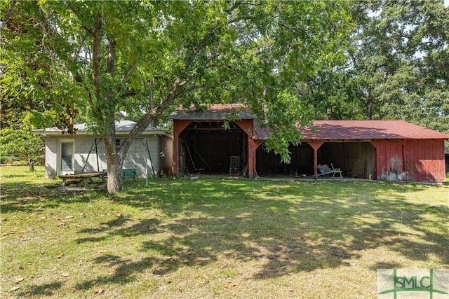 exterior space featuring an outbuilding and a front yard