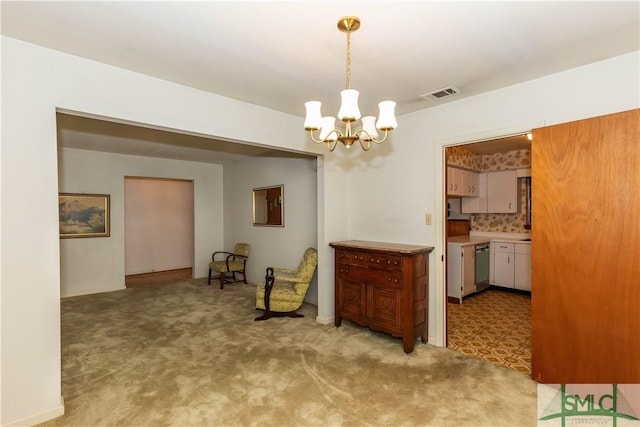 dining area with light carpet and a notable chandelier