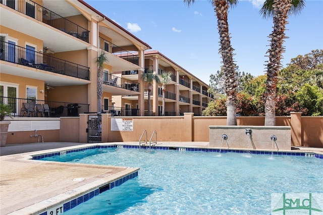 view of pool with pool water feature