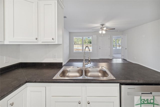 kitchen featuring dishwasher, sink, white cabinets, and ceiling fan