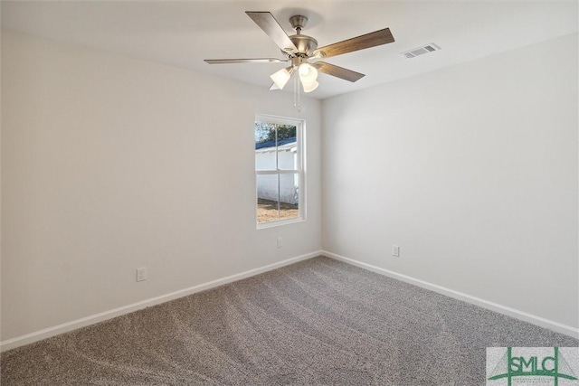 spare room featuring ceiling fan and carpet flooring