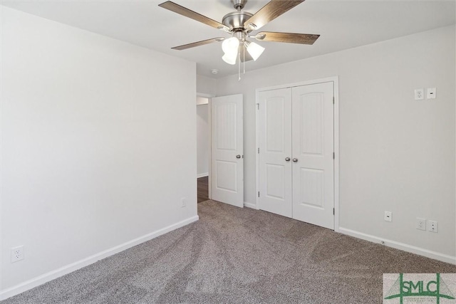 unfurnished bedroom with carpet flooring, ceiling fan, and a closet