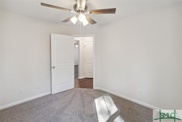 carpeted empty room with ceiling fan