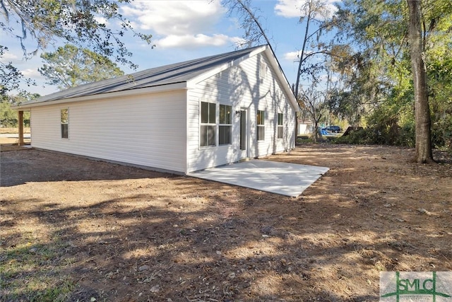 rear view of property featuring a patio