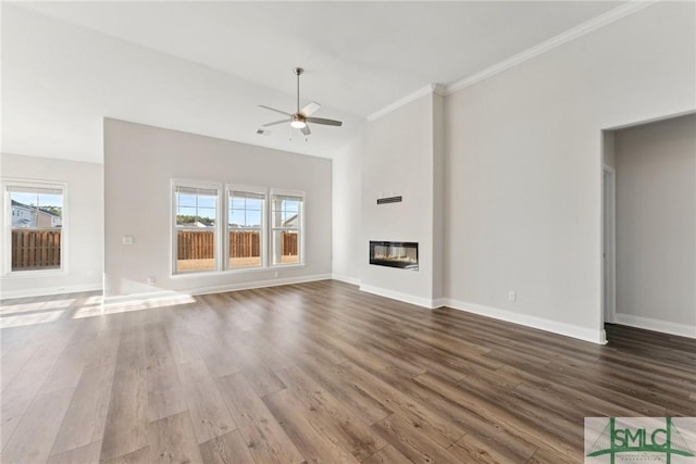 unfurnished living room featuring hardwood / wood-style flooring, crown molding, heating unit, and ceiling fan