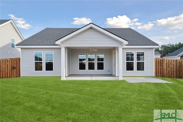 rear view of house with a yard, a patio area, and ceiling fan