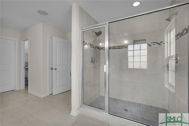 bathroom featuring tile patterned flooring and walk in shower