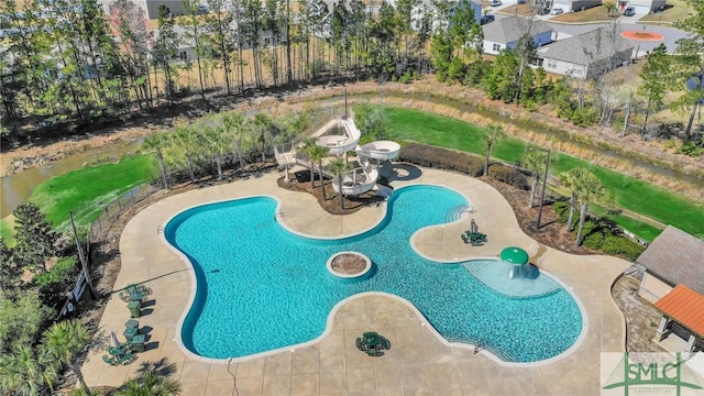 view of swimming pool with a patio