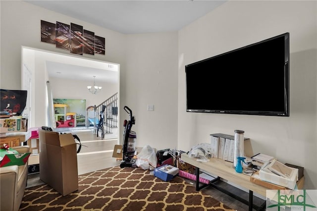 interior space featuring dark wood-type flooring and a chandelier