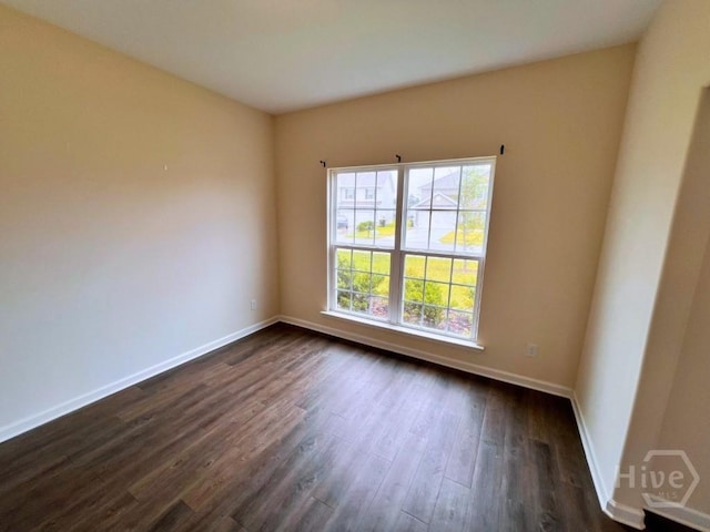125 Grimsby Rd, Savannah, GA 31407 - unfurnished room featuring baseboards and dark wood-type flooring