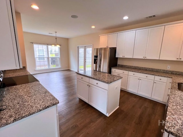 125 Grimsby Rd, Savannah, GA 31407 - kitchen featuring stainless steel fridge, dark wood-type flooring, white cabinets, recessed lighting, and a kitchen island