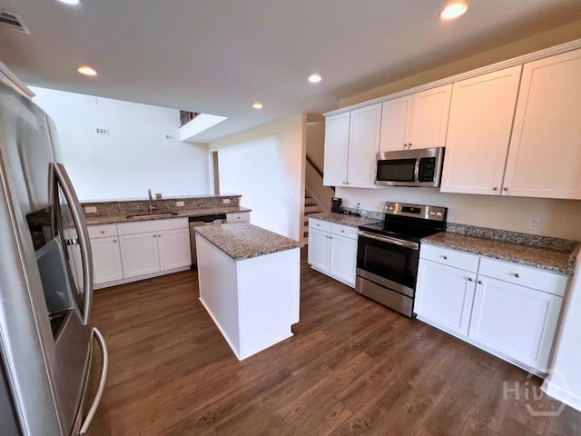 125 Grimsby Rd, Savannah, GA 31407 - kitchen featuring stainless steel appliances, white cabinetry, dark wood-type flooring, a sink, and recessed lighting
