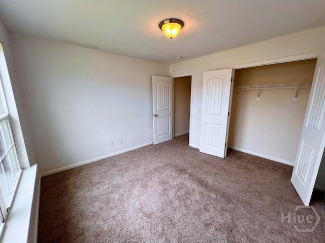 125 Grimsby Rd, Savannah, GA 31407 - unfurnished bedroom featuring carpet, a closet, and baseboards