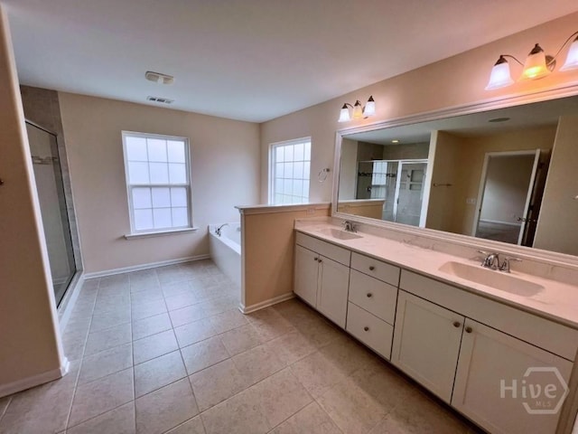 125 Grimsby Rd, Savannah, GA 31407 - bathroom with double vanity, tile patterned flooring, a stall shower, a bath, and baseboards