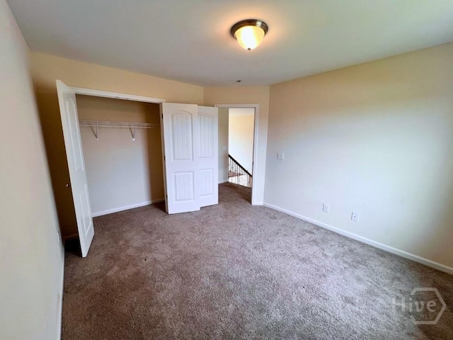 125 Grimsby Rd, Savannah, GA 31407 - unfurnished bedroom featuring carpet, a closet, and baseboards