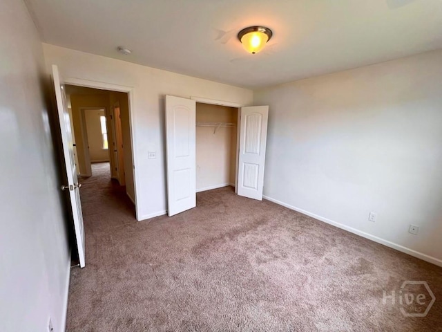 125 Grimsby Rd, Savannah, GA 31407 - unfurnished bedroom with carpet floors, baseboards, and a closet