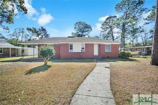 single story home with a front yard and a carport