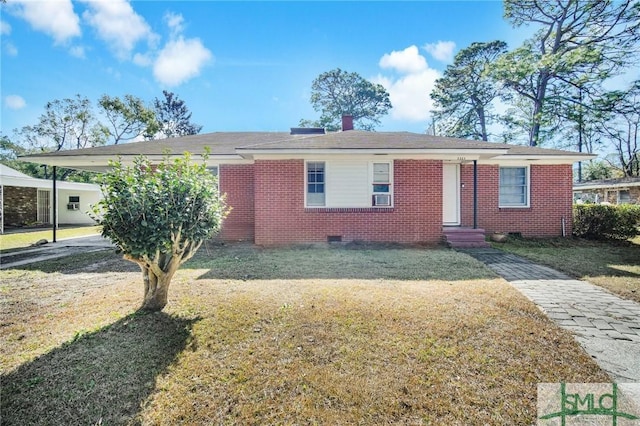 view of front facade with a front yard and a carport