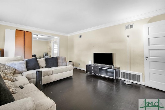 living room featuring ornamental molding and dark hardwood / wood-style floors