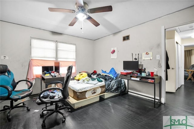 bedroom featuring dark wood-type flooring and ceiling fan