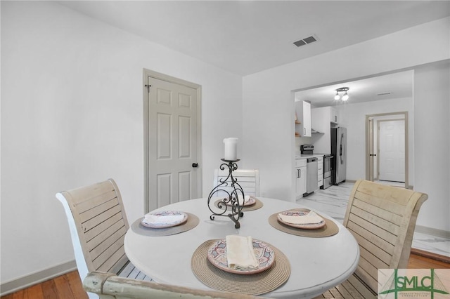 dining area featuring light hardwood / wood-style flooring