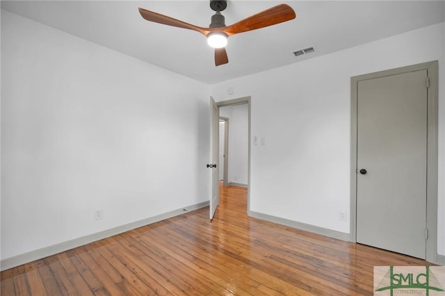 spare room with ceiling fan and light hardwood / wood-style flooring