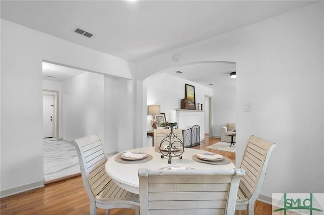 dining area with light hardwood / wood-style floors