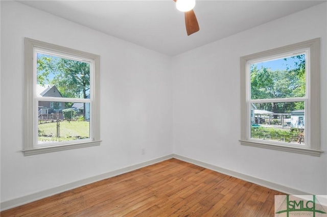 empty room featuring ceiling fan and light wood-type flooring