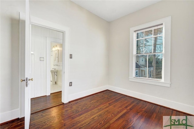 spare room featuring hardwood / wood-style floors