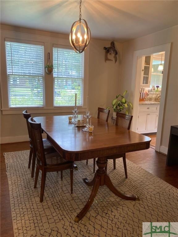 dining area with dark wood-type flooring