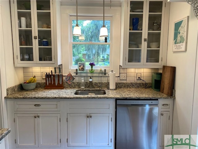 bar with pendant lighting, light stone counters, stainless steel dishwasher, and white cabinets