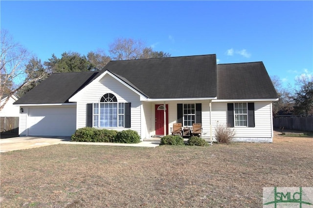 view of front of home featuring a garage and a front lawn