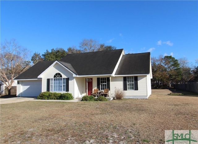 view of front of home with a garage and a front lawn