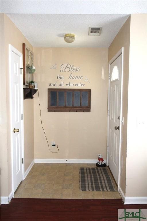 foyer featuring wood-type flooring