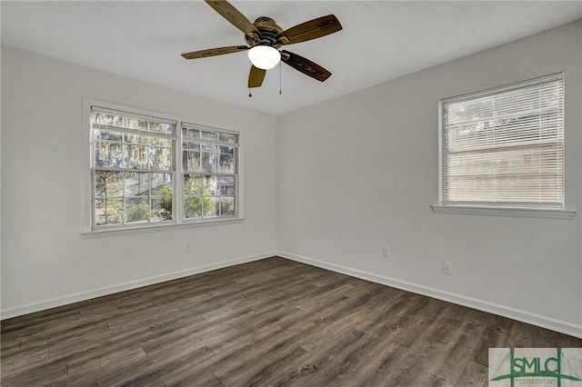 spare room featuring dark hardwood / wood-style floors and ceiling fan