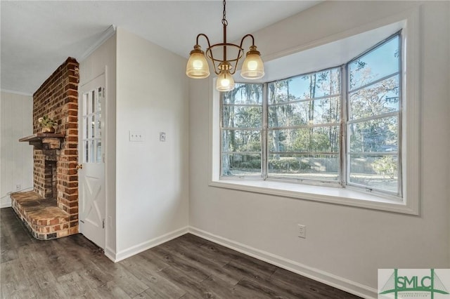 unfurnished dining area featuring a notable chandelier and dark hardwood / wood-style flooring